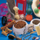 Bowl of pet food & supplies including dog food, cat food, bones, treats, brushes and pet toys