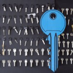 Keys for cutting and a big symbolic blue key