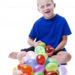 Boy with water balloons